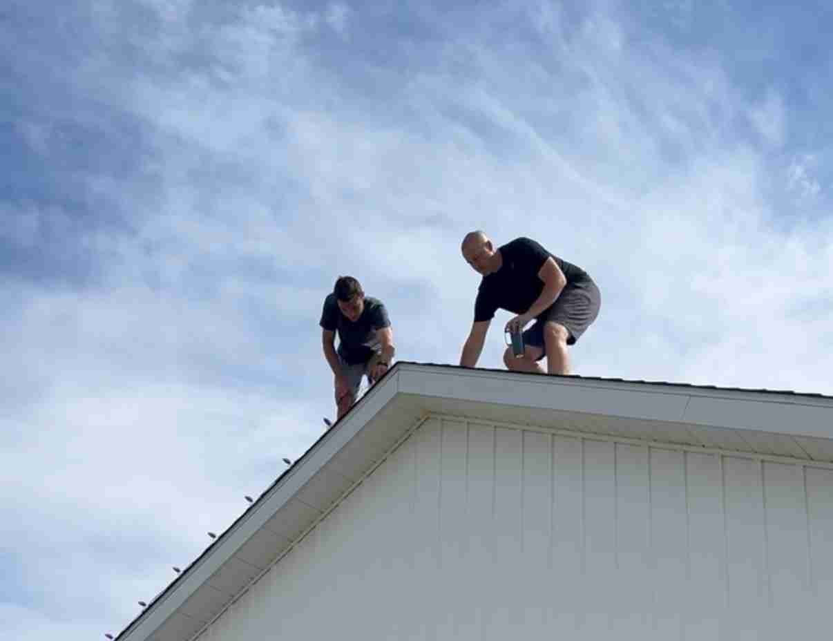 Royal Lights VA installing Christmas lights on a roofline