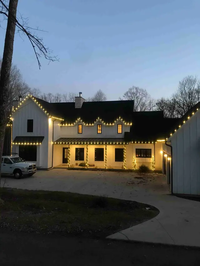 Modern farmhouse with warm white Christmas lights