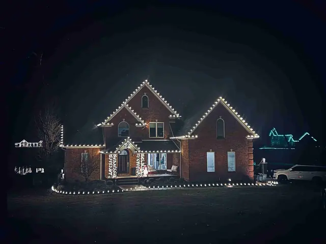 Large brick house with extensive Christmas light display