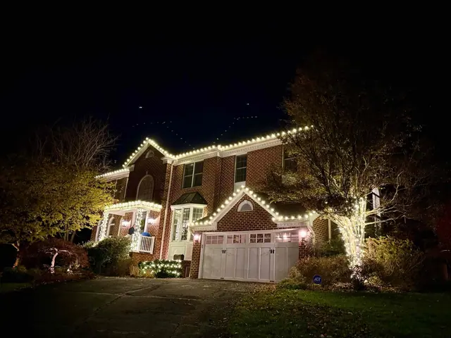 Brick house with extensive warm white Christmas lights